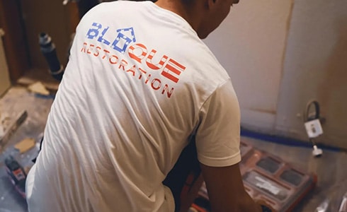 Bloque Restoration Worker Restoring A Home After A Storm